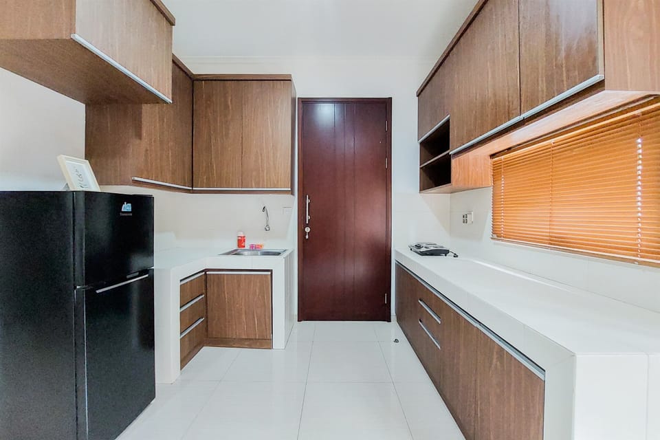 Apartment | Private kitchen | Fridge, stovetop, rice cooker, dining tables
