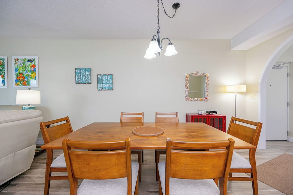 Gather around the dining table, enjoying the cheerful decor and sharing laughter as you create new memories