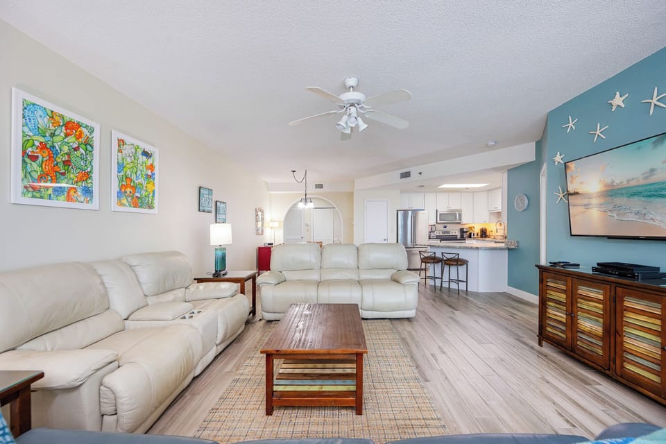 Unwind on the soft couches, enjoying the vibrant coastal decor and streaming your favorite shows with loved ones
