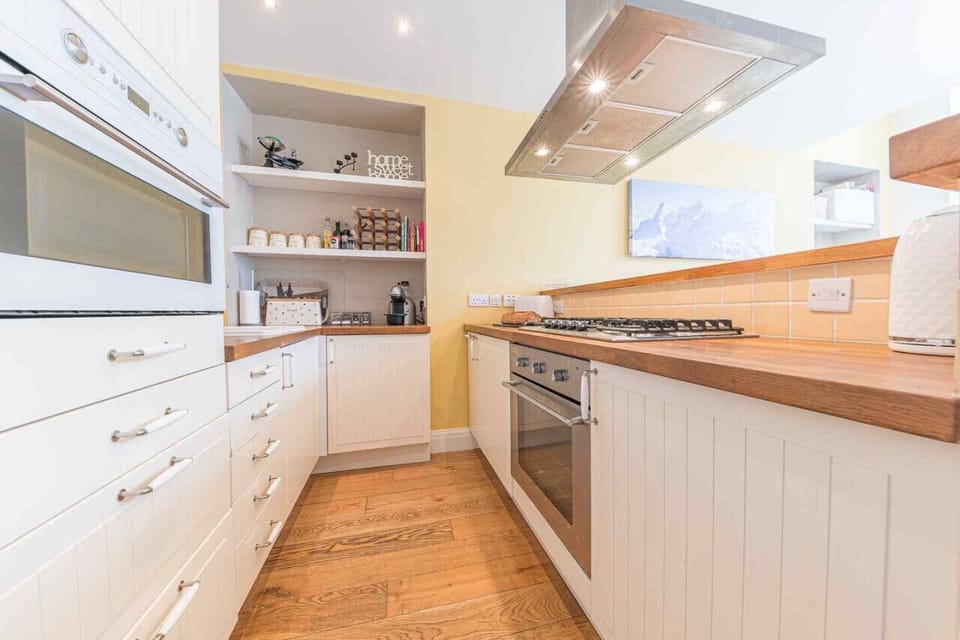 Fully equipped kitchen with gas hob, electric oven, microwave and Krups coffee machine