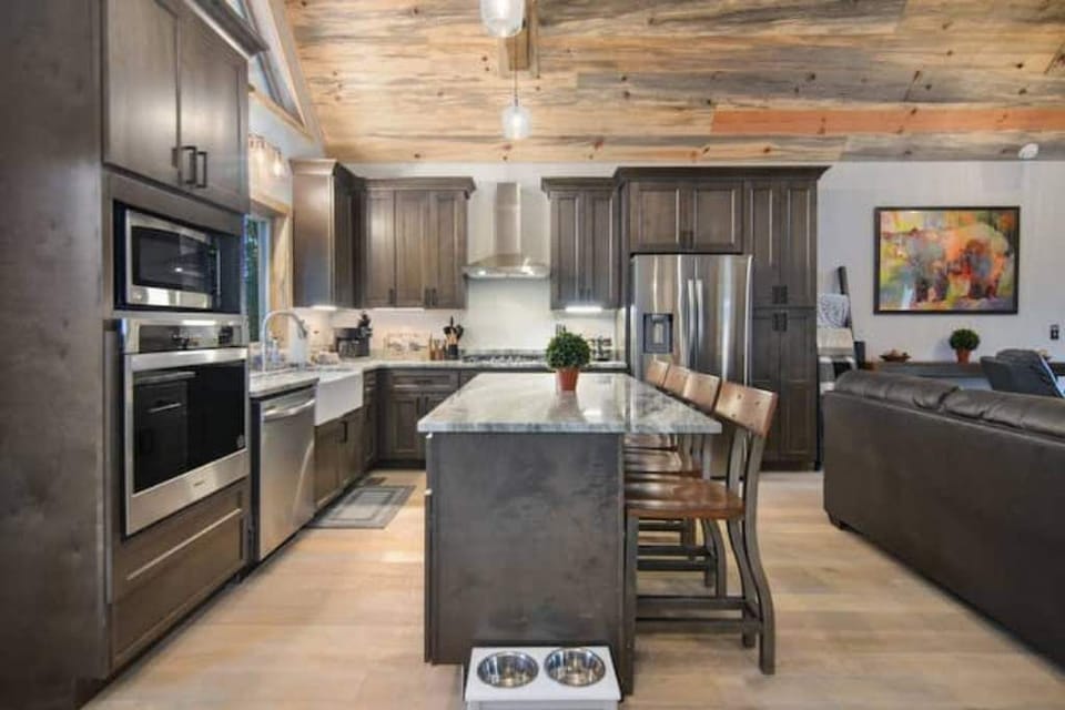 Beautifully designed kitchen with 4 bar seats & top of the line appliances