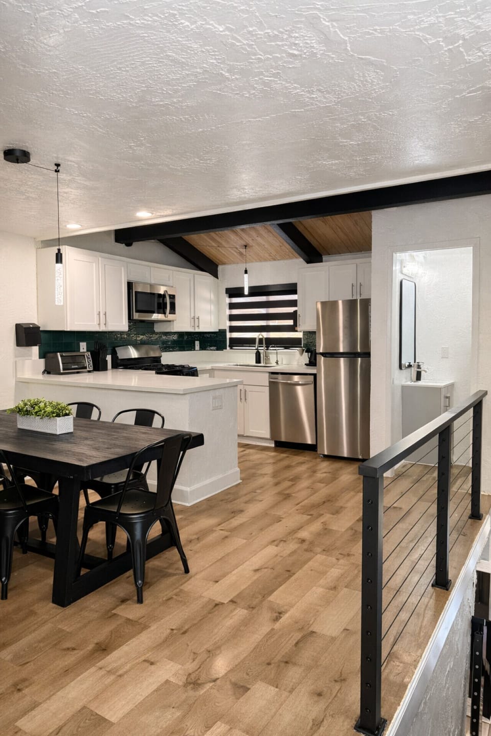 Open dining and kitchen area designed for gathering, with modern finishes and plenty of space to cook and enjoy meals together.