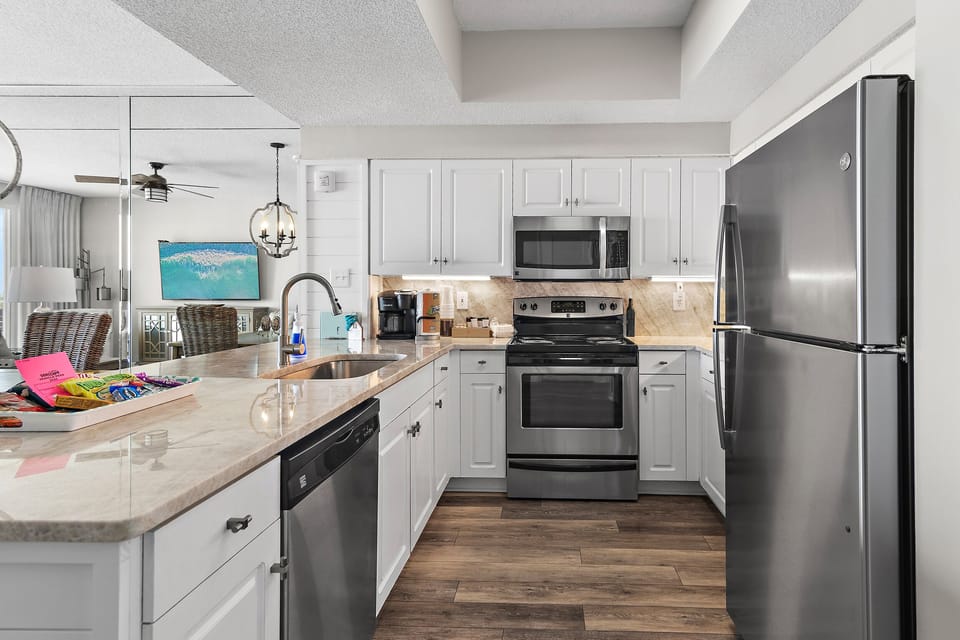 REMODELED Kitchen has GULF VIEWS, granite countertops, stainless appliances - fully stocked with more than the basics (coffee/tea bar, oils/spices, Tupperware, plenty of pots/pans/cookware)