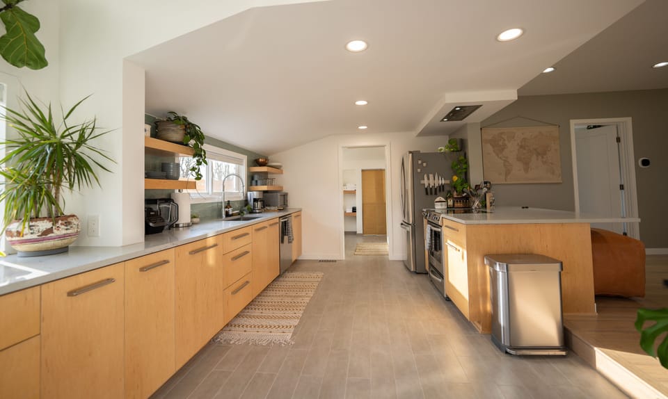 Kitchen fully stocked with modern, stainless steel amenities, ready to use
