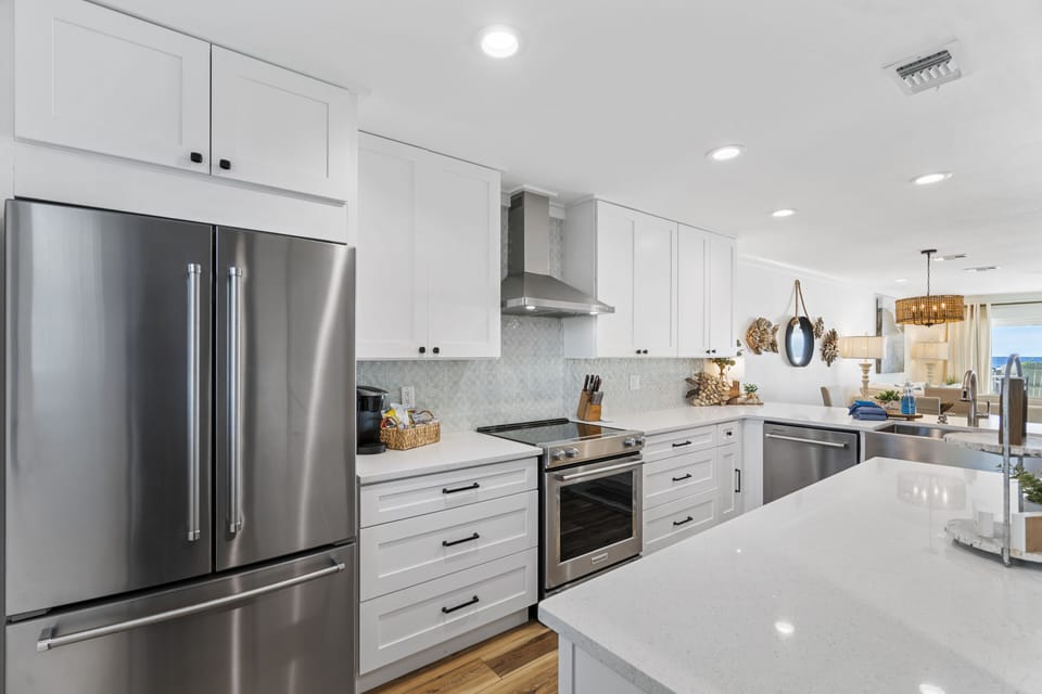 Large Open Concept Kitchen with stainless steel appliances throughout.