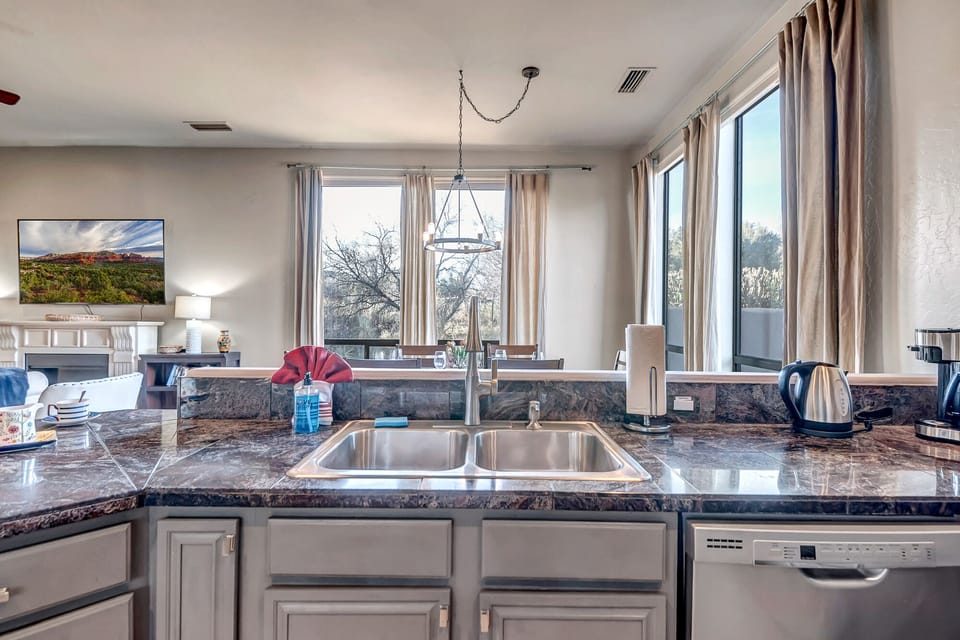 Fully Equipped Kitchen with Stainless Steel Appliances and Bar Seating for 2