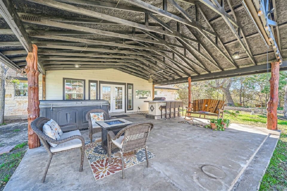 Relax on the large covered patio with hot tub, pool and BBQ (Front home of 3 homes)