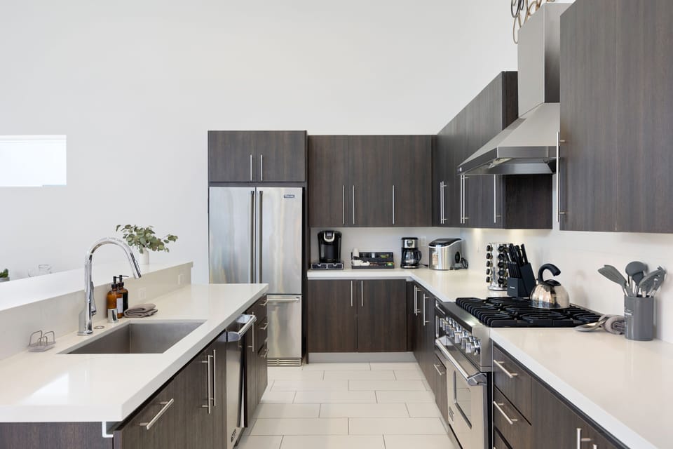 Modern appliances in the chef's kitchen, including a gas range.
