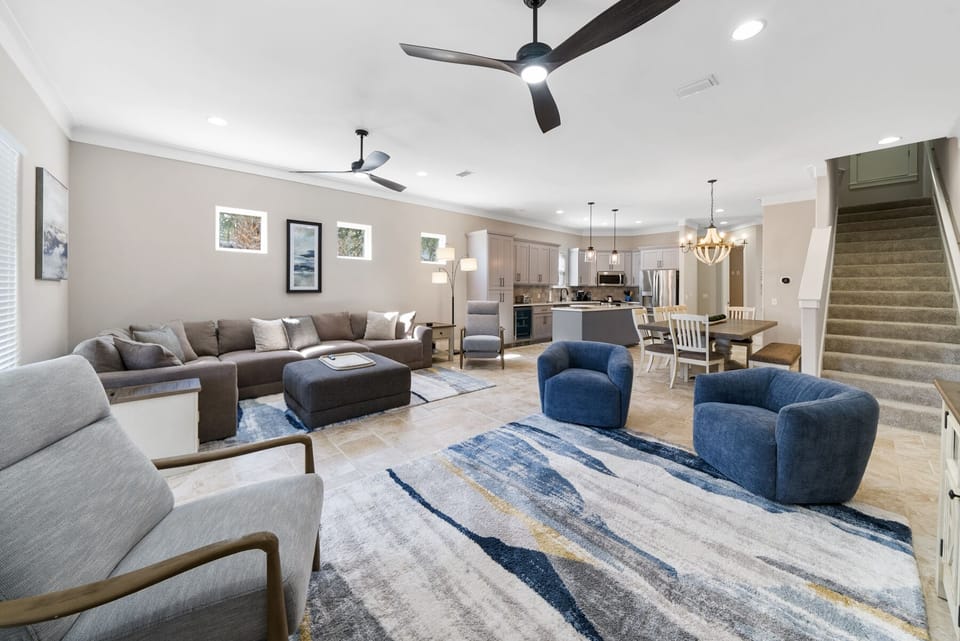 Sink into plush seating in your open-concept living space, where modern comfort meets thoughtful design for memorable gatherings.