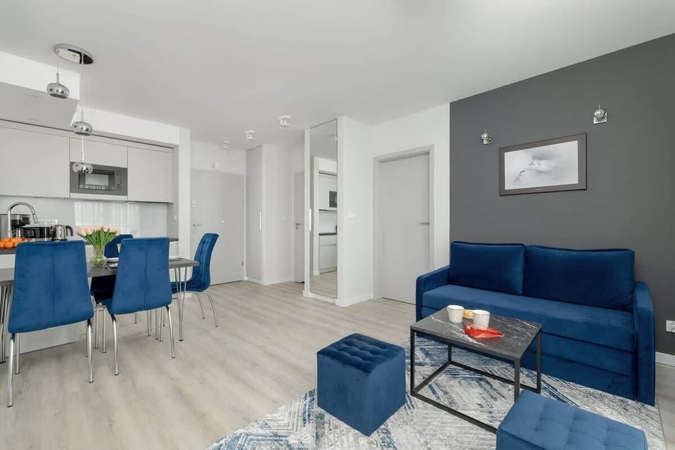 Another angle of the living room, highlighting the open-plan design and contemporary furniture.
