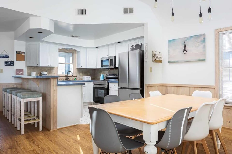 Stocked kitchen with breakfast bar (seats 4) and dining space (seats 8), perfect for cooking and gathering!