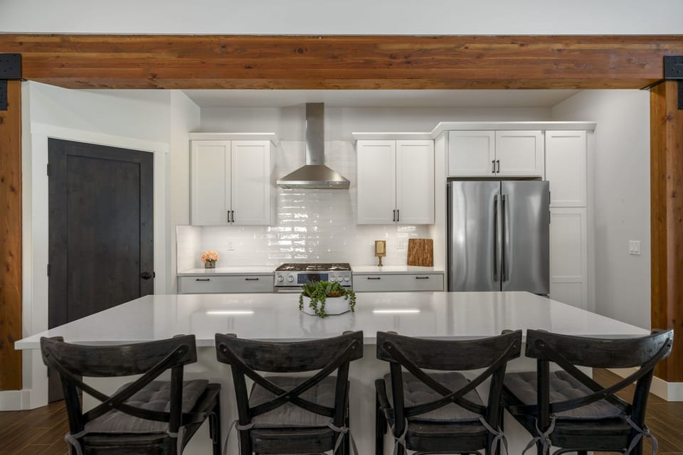 The spacious island offers ample seating, making it a perfect gathering spot for family and friends