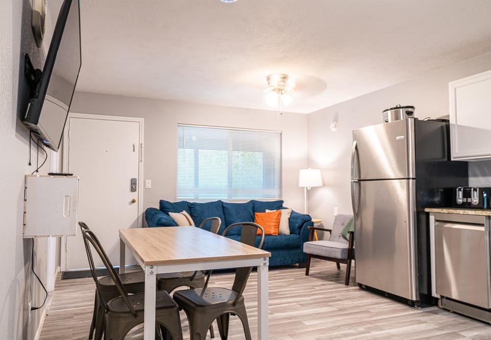 Front door leads to living area, kitchen, and dining