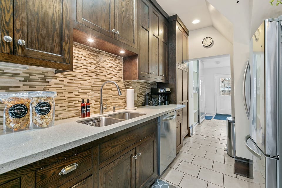 Your fully equipped kitchen features rich wood cabinets, granite counters, and stainless appliances for effortless meal prep.