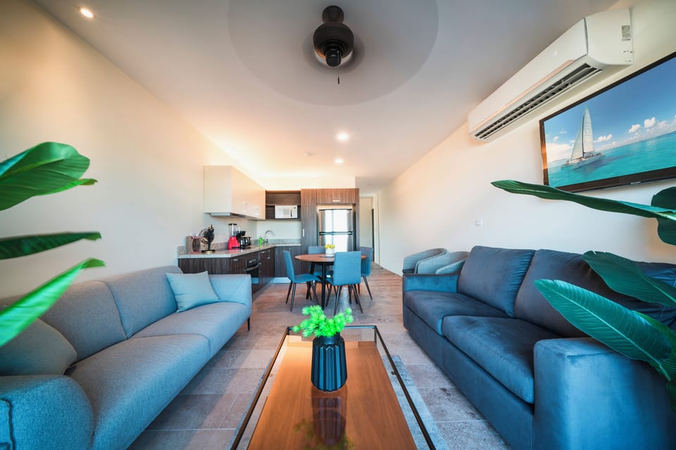Deluxe Condo | Living area | 40-inch flat-screen TV with digital channels