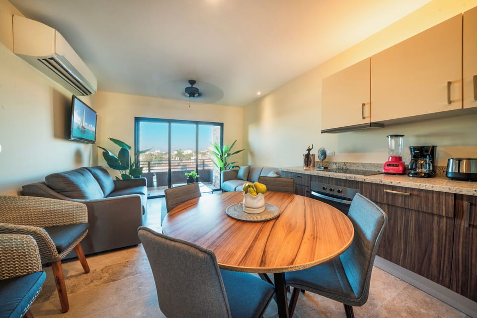 Deluxe Condo | Private kitchen | Full-size fridge, microwave, toaster, blender