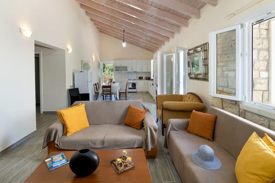 Open-plan living room with sofa, dining area, kitchen, WiFi internet, and satellite TV