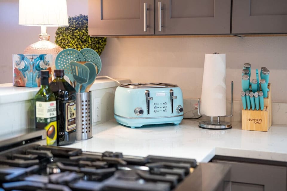 KITCHEN | Fully equipped modern kitchen with all-steel appliances | Gas top stove, extractor and Z-Line Oven | HUGE refridgerator | Dishwasher | Toaster | Keurig Coffee Maker | Adult & Child friendly plates & silverware
