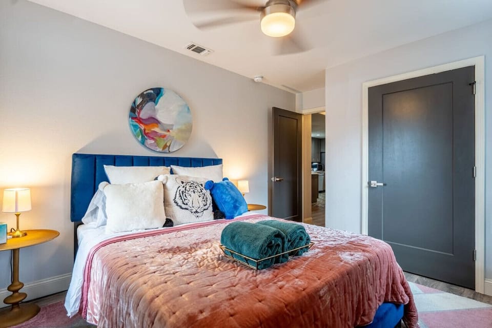 Flamingo Bedroom (bedroom 1) with QUEEN size bed, fresh towels, ceiling fan, and your own  private closet space.