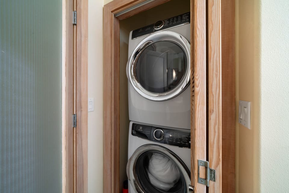 Downstairs full bath with Walk-in Shower and Stackable Washer and Dryer.