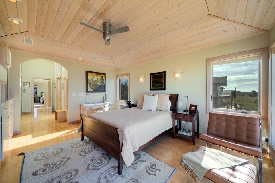 Master Bedroom with spectacular ocean views, gas fireplace, luxury linens, overhead fans, desk workspace. attached master bath with Jacuzzi tub, double sinks, nespresso coffee station.