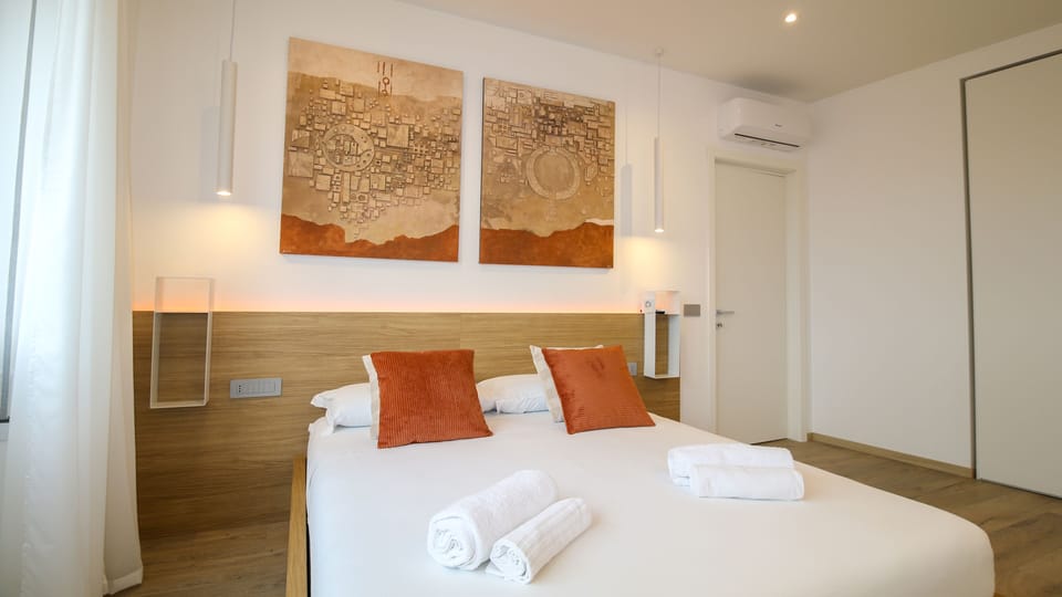 Deluxe Quadruple Room | Down comforters, memory foam beds, in-room safe, individually furnished