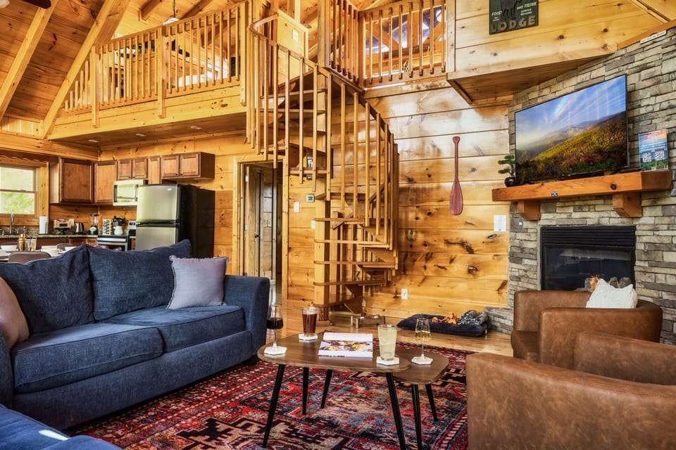 Open space living and dining area with beautiful Cathedral ceilings.