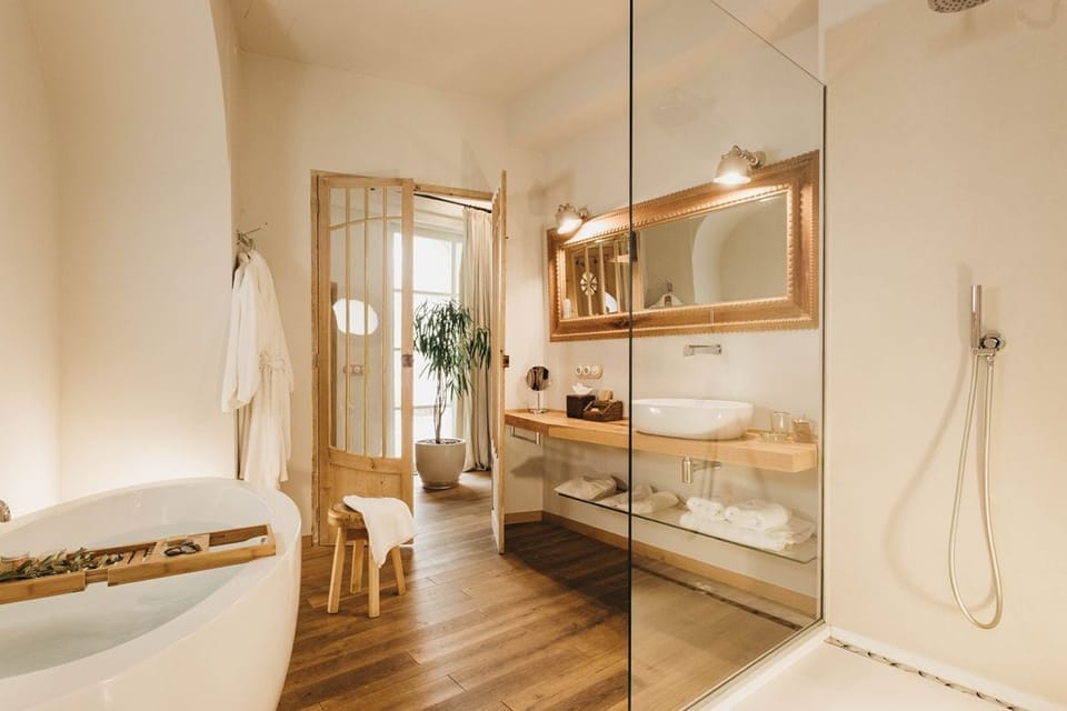 Suite, Patio | Bathroom | Separate tub and shower, designer toiletries, hair dryer, bathrobes