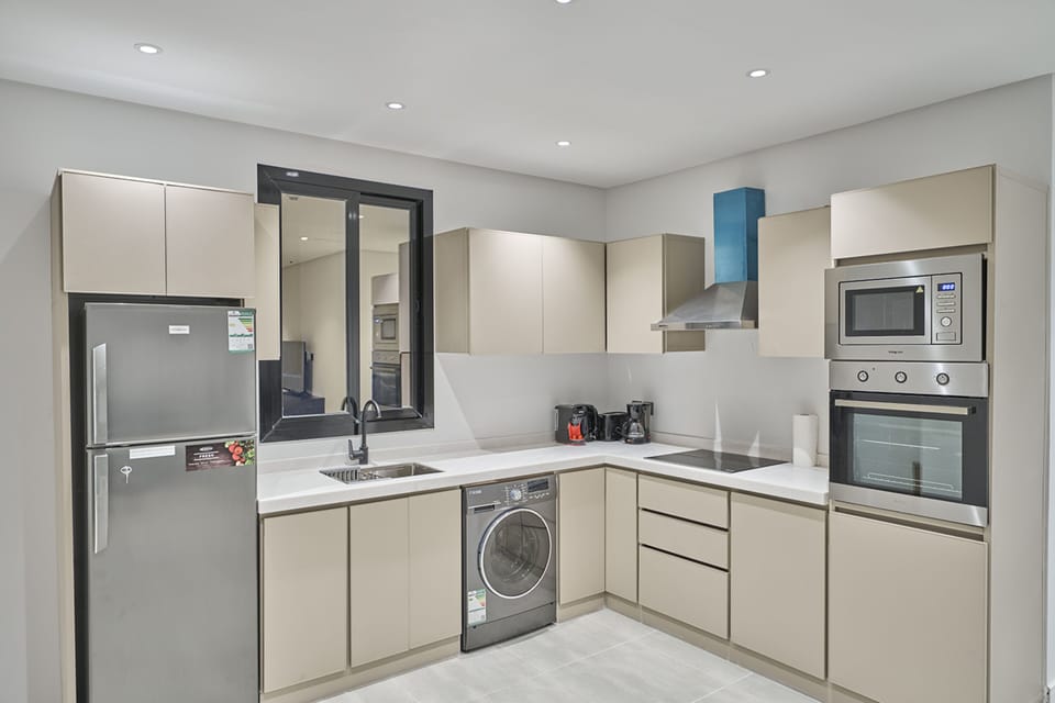 Apartment, 2 Bedrooms | Private kitchen | Fridge, espresso maker, electric kettle, dining tables