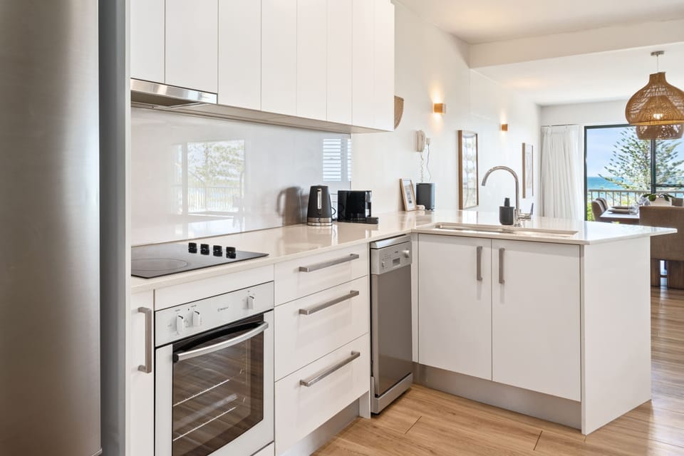 The kitchen caters to a cooks every need with quality appliances.