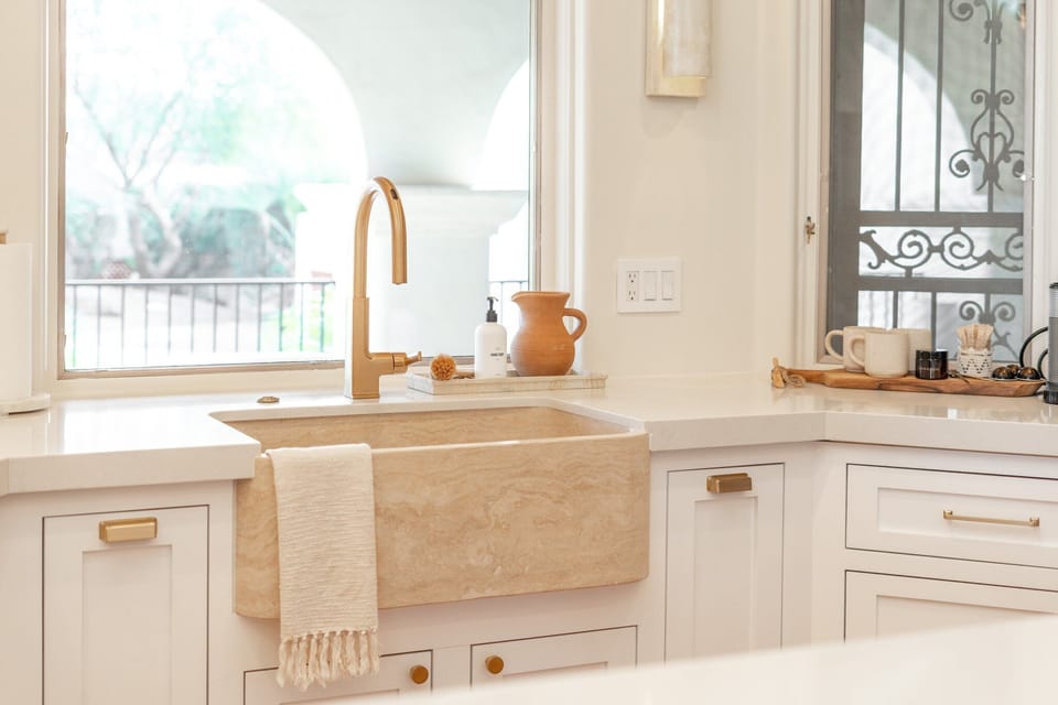 "The kitchen was fully stocked with everything we needed, and the outdoor areas were incredible — multiple dining spots, comfortable loungers, a hot tub, and a pool with stunning views of the desert landscape."