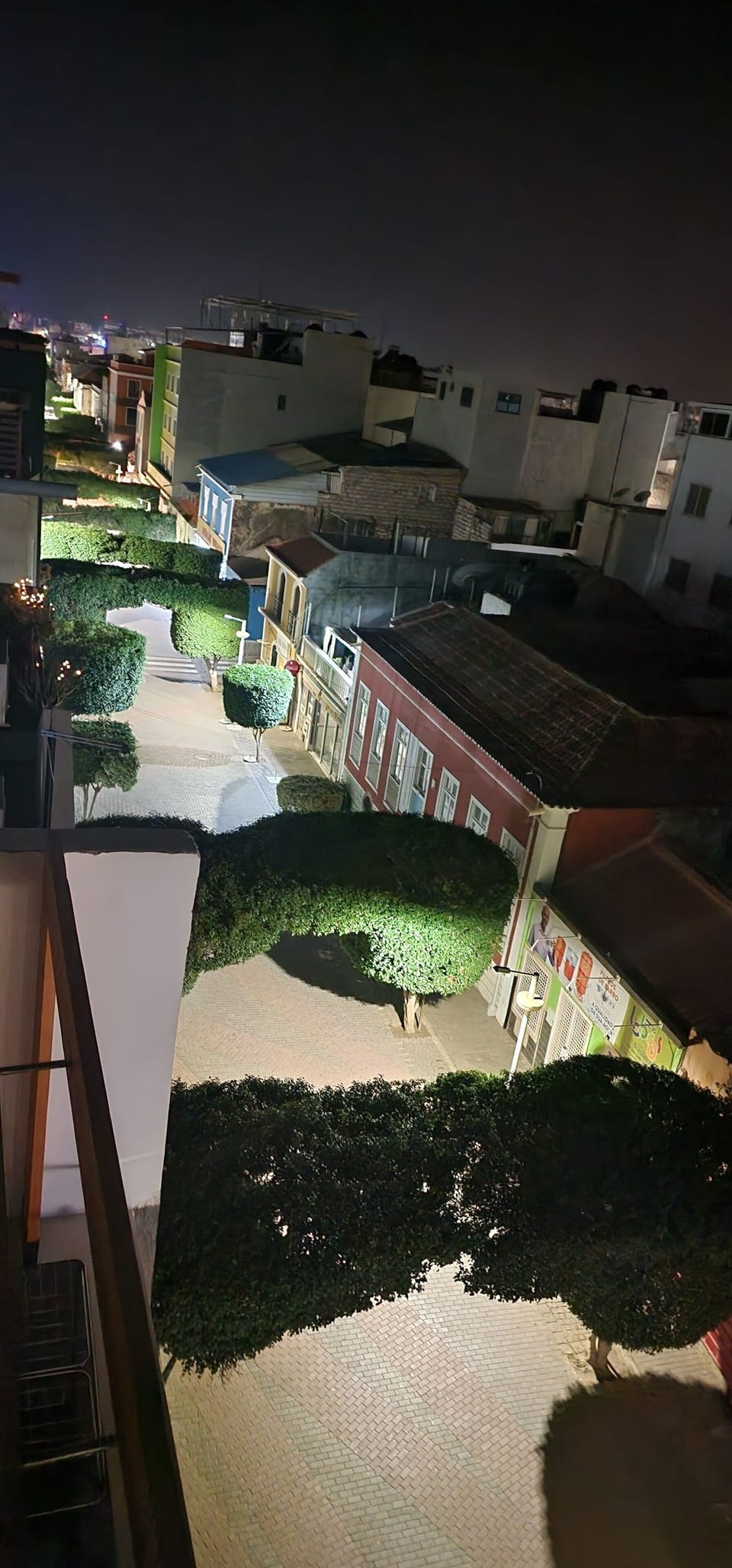Nighttime city view from private balcony