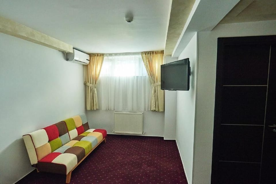 Desk, iron/ironing board, bed sheets