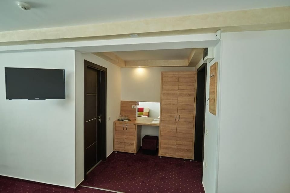 Family Room, 1 Bedroom | Desk, iron/ironing board, bed sheets