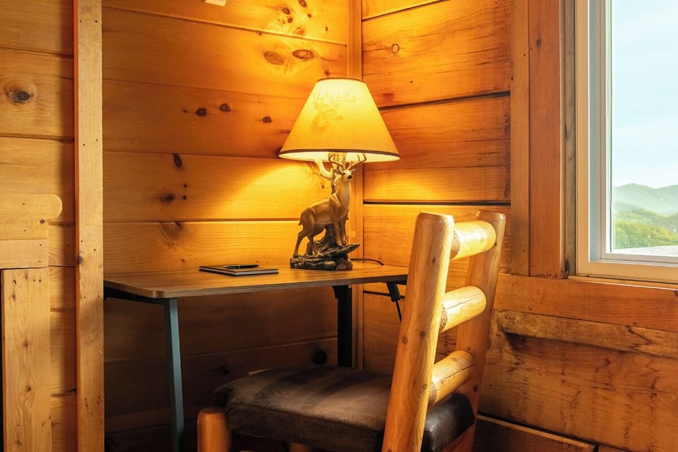 Settle into your cozy corner workspace with warm wood surroundings and mountain views just outside your window—perfect for catching up on emails or journaling about your adventures.