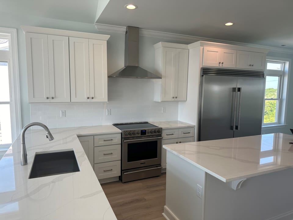 Kitchen with plenty of cabinet space, large pantry, oversized fridge, two ovens