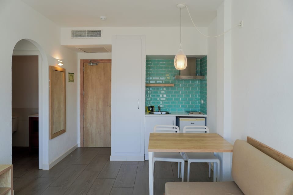 Studio, Balcony, Pool View (2 adults) | Living room | 32-inch plasma TV with satellite channels, TV