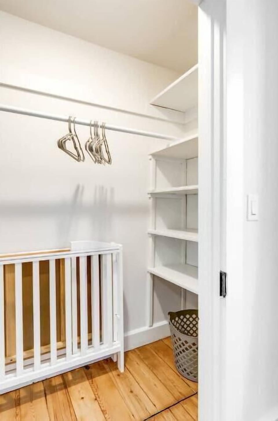Bedroom 2 closet with crib 