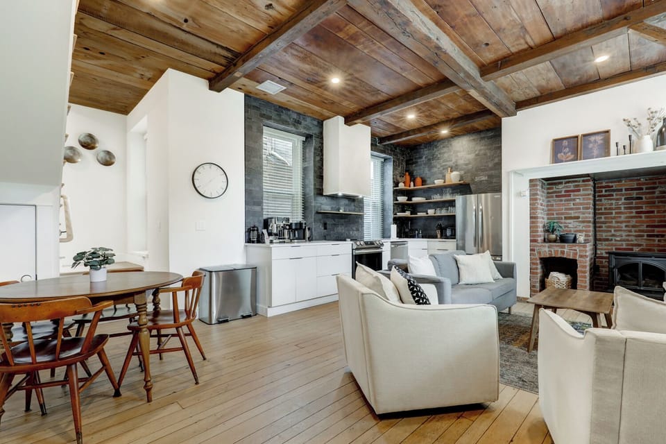 First floor with kitchen, living area, and inglenook fireplace 