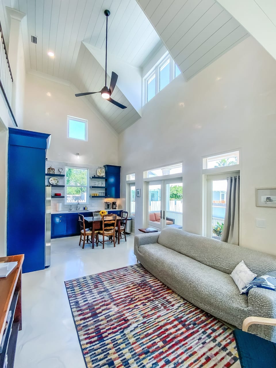 Soaring ceilings and lots of light in the open living room/dining room/kitchen
