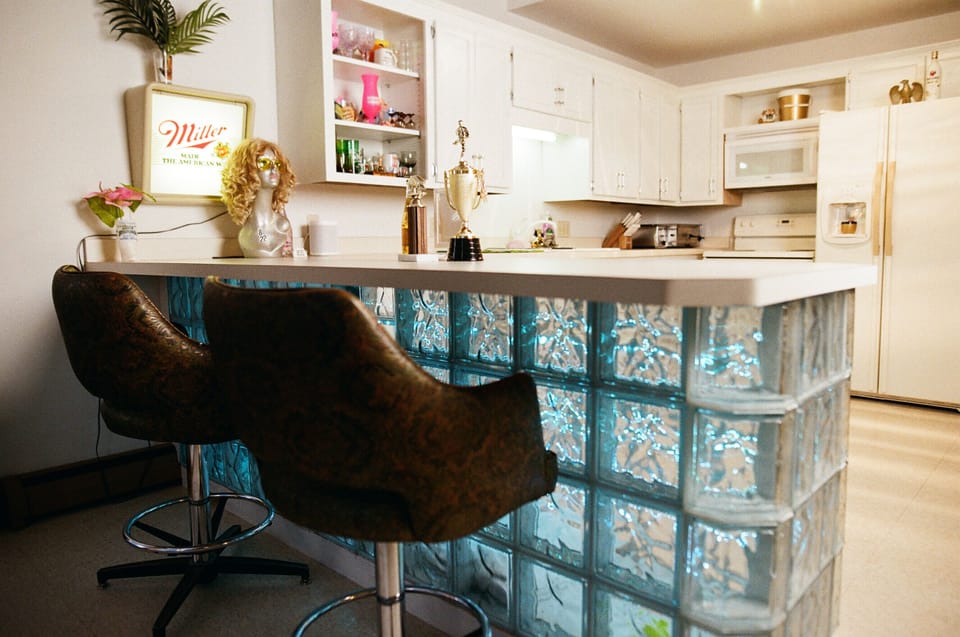 Kitchen with glass block bar lit up with LED lights. 