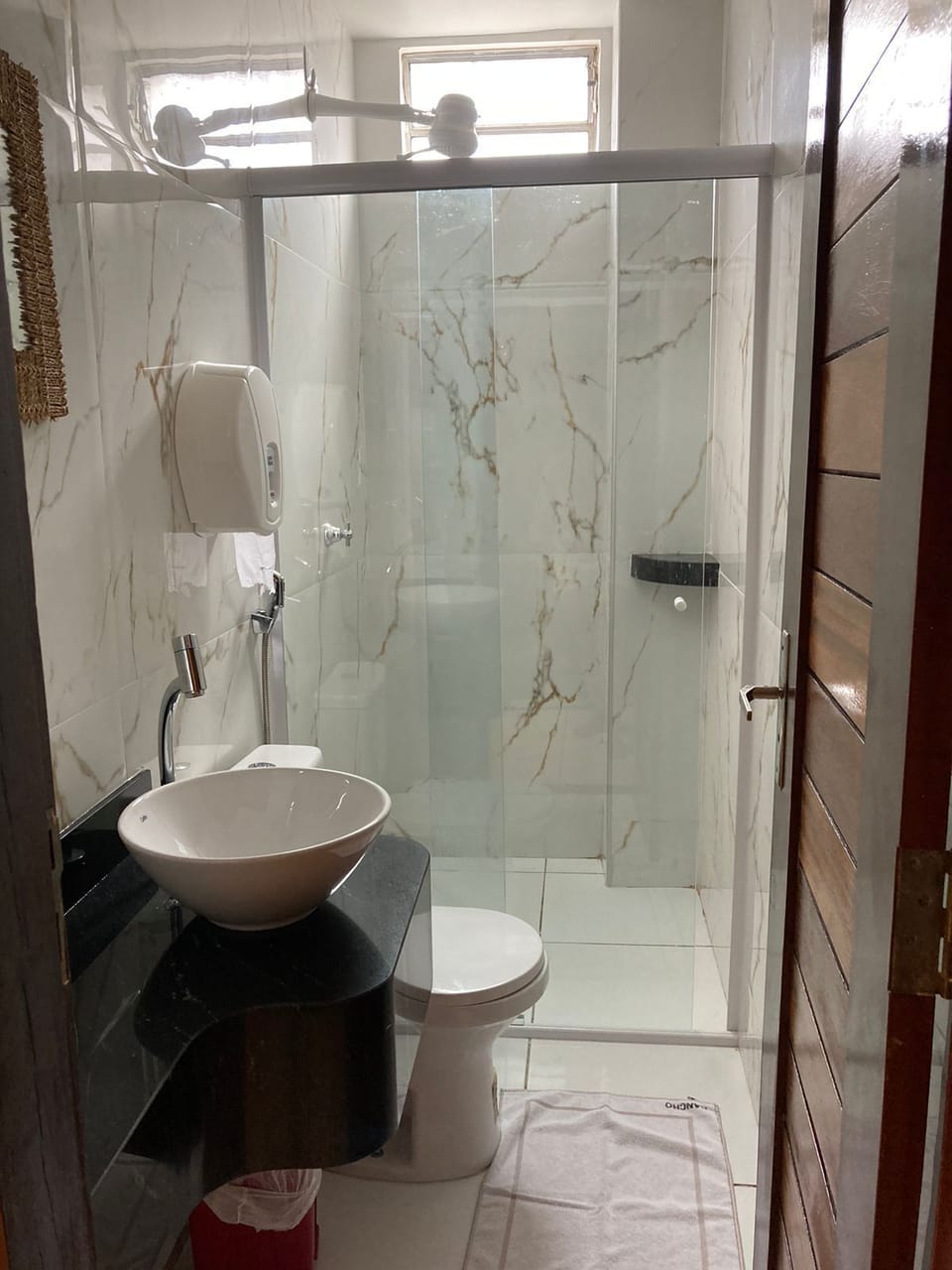 Shower, towels, soap, toilet paper