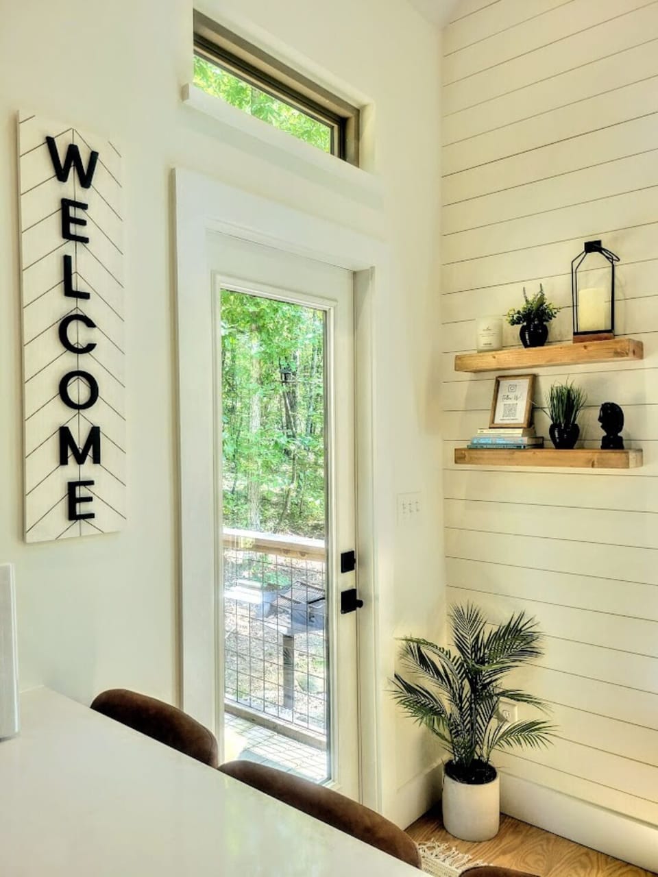 Door to back porch. Charcoal grill and private back yard.