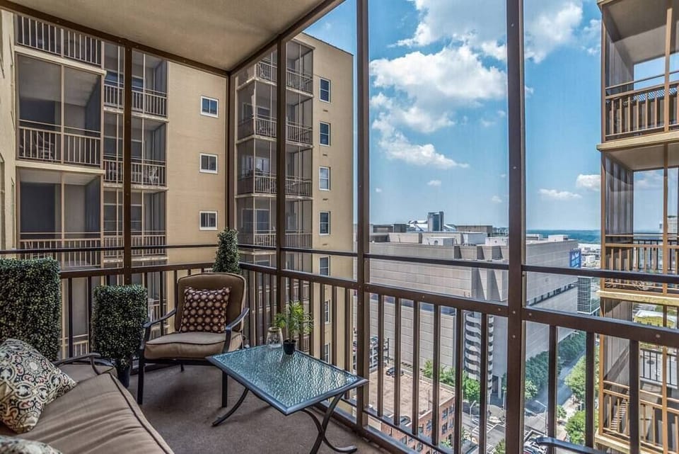Step outside to enjoy sweeping views of downtown Atlanta from your enclosed balcony