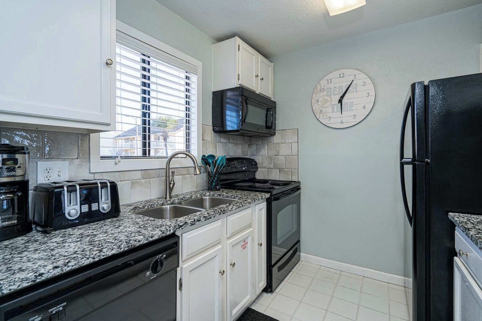 Condo, Multiple Beds, Balcony (Beachfront Joy at Sandpiper Cove) | Private kitchen | Fridge, microwave, oven, stovetop