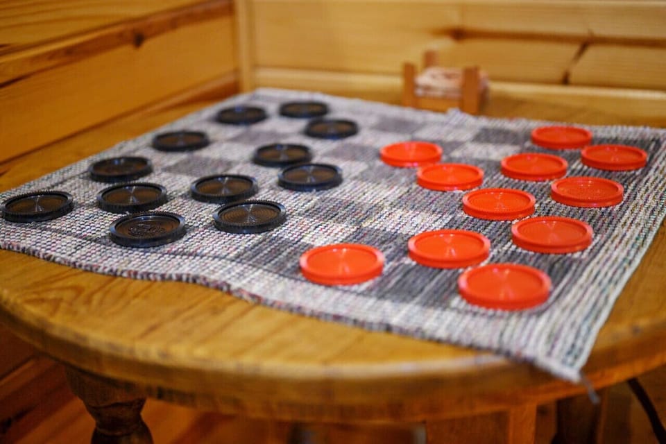 Chill vibes and checkered boards: cabin checkers time.