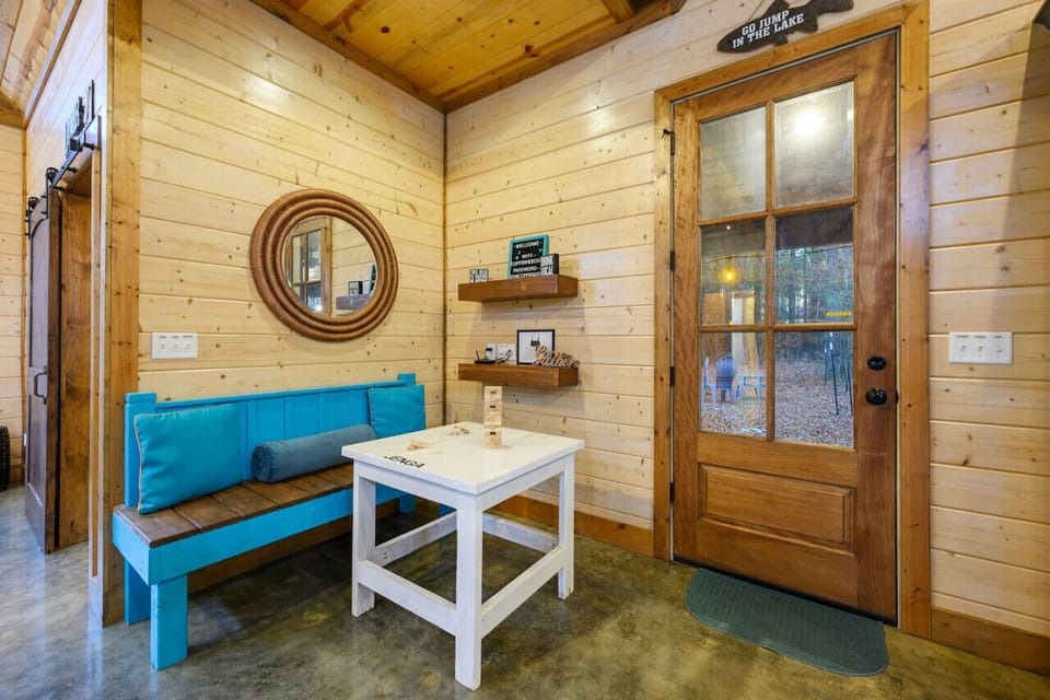 Experience the perfect blend of comfort and convenience in our charming seating area with a table.