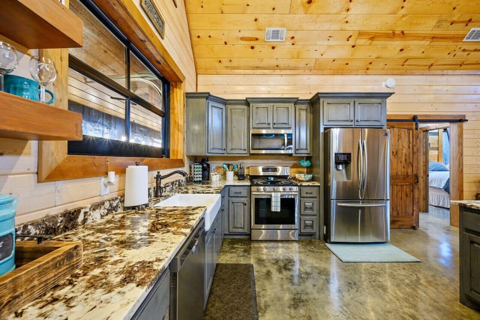 Enjoy the convenience and sophistication of our upscale kitchen adorned with stainless steel appliances.