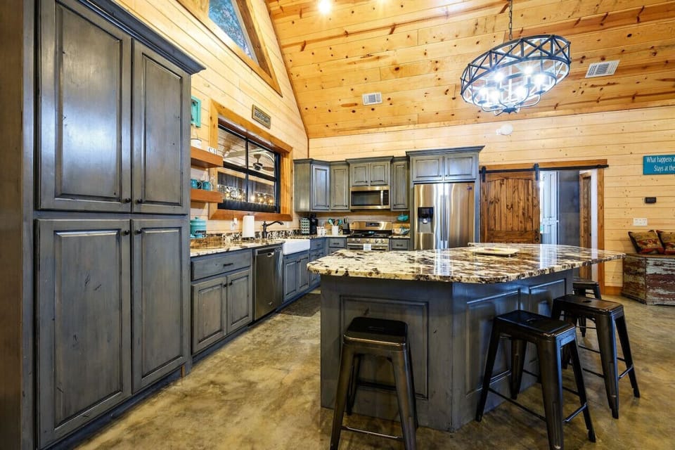 Prepare delicious meals with ease in our state-of-the-art kitchen with stainless steel appliances.