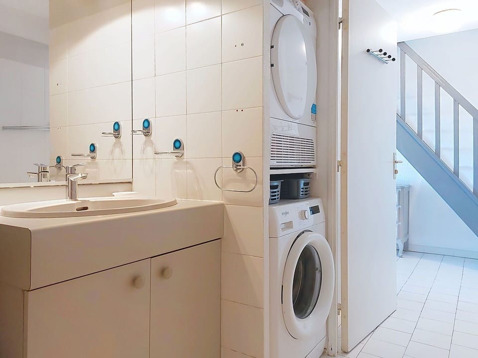 Washing Machine, Flooring, Floor, Interior Design, Laundry Room, Clothes Dryer, Major Appliance, Ceiling, Room, Plumbing Fixture